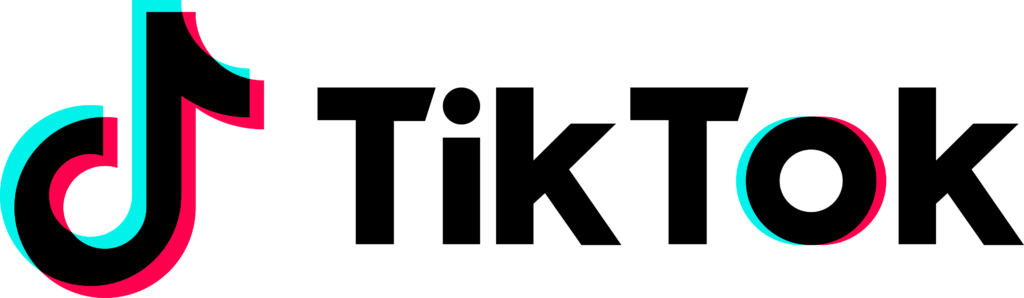 Smartphone displaying a viral TikTok video with negative comments and a falling sales graph in the background